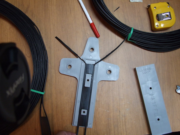 LadderLoc(TM) in mid-assembly on ladder line feeding VE2DPE's double doublet antenna for 80 and 40 meters.