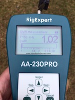 Antenna analyzer shows that VE2DPE's linear-loaded 40 m NVIS antenna, under test, has a 1.02 to 1 SWR.