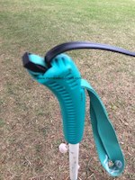 Picture shows one extremity of a twin lead linear-loaded dipole NVIS antenna inserted in the ski pole handle serving as end support.