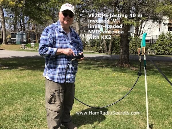 Picture shows VE2DPE in the process of testing his 40 m inverted 'V' linear-loaded NVIS antenna.