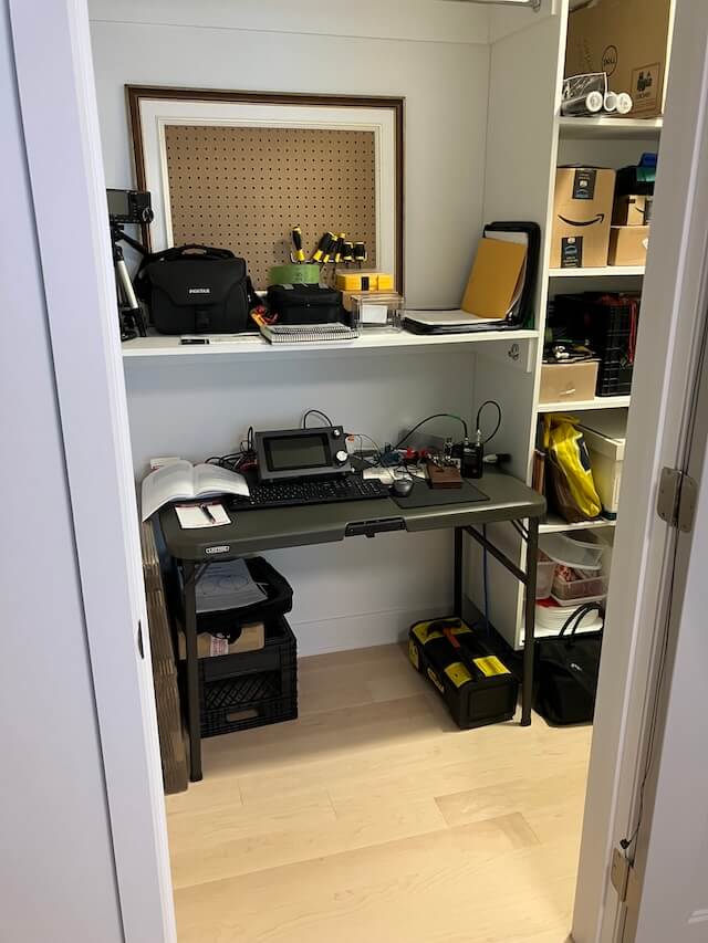 Ham radio shack in walk-in wardrobe.