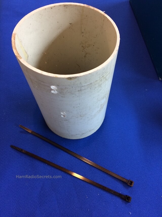 Holes in PVC pipe for coax RF choke tiewraps